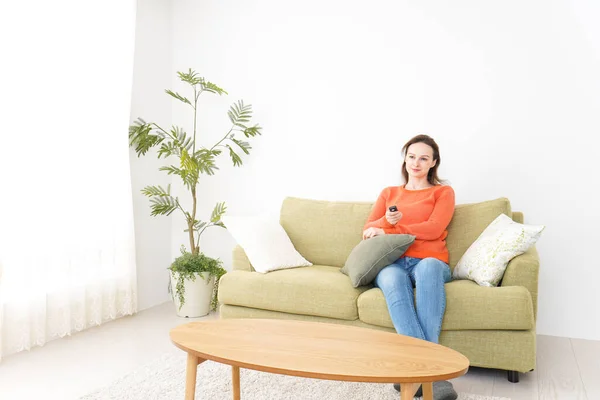 Young Woman Watching Home — Stock Photo, Image