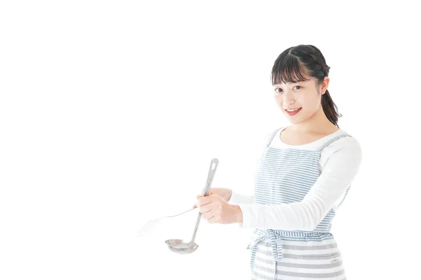 Giovane Donna Che Tiene Utensili Cucina Sfondo Bianco — Foto Stock