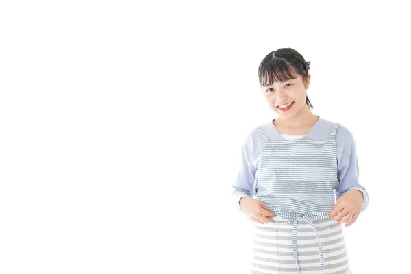 Junge Hausfrau Lächelt Mit Weißem Hintergrund — Stockfoto