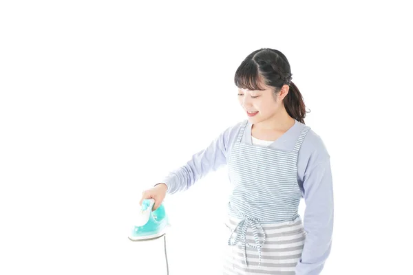 Young Woman Showing Iron — Stock Photo, Image