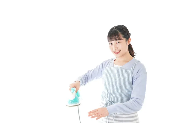 Young Woman Showing Iron — Stock Photo, Image
