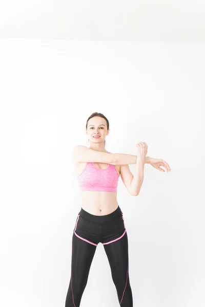 Young Woman Wearing Sportswear Stretching — Stock Photo, Image