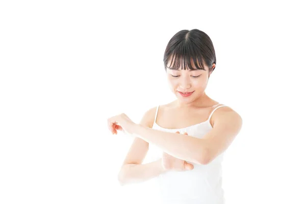 Young Woman Using Body Milk — Stock Photo, Image
