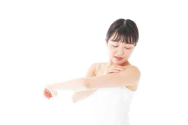 Young Woman Using Body Milk — Stock Photo, Image