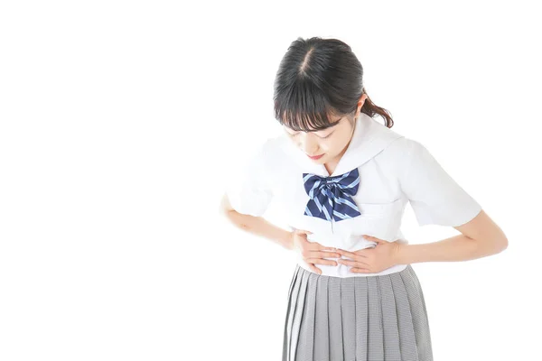 Gadis Sekolah Dengan Senyum Menderita Kram Menstruasi — Stok Foto