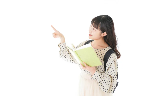 Uśmiechnięta Młoda Azjatycka Studentka Wskazująca Coś — Zdjęcie stockowe