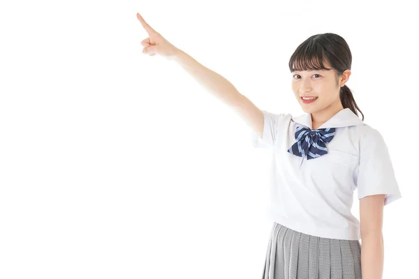 Smiling Young Asian Female Student Pointing Something — Stock Photo, Image