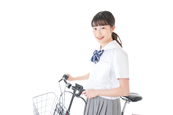 自転車の制服を着た女の子自転車で通学する学生 — ストック写真