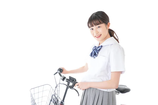 自転車の制服を着た女の子自転車で通学する学生 — ストック写真