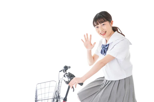 自転車の制服を着た女の子自転車で通学する学生 — ストック写真