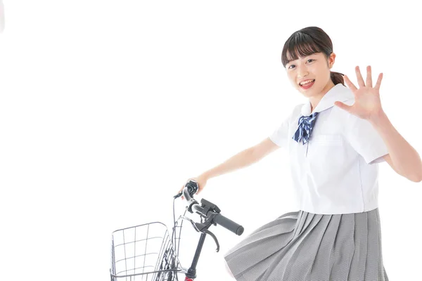 自転車の制服を着た女の子自転車で通学する学生 — ストック写真