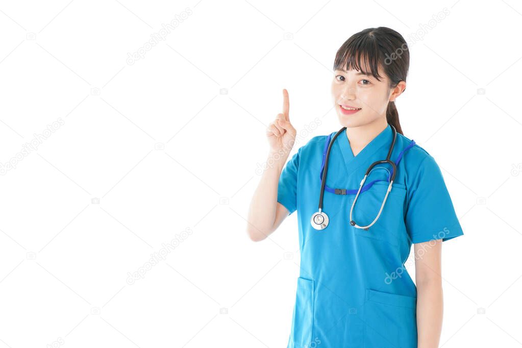a young nurse with a smile pointing something