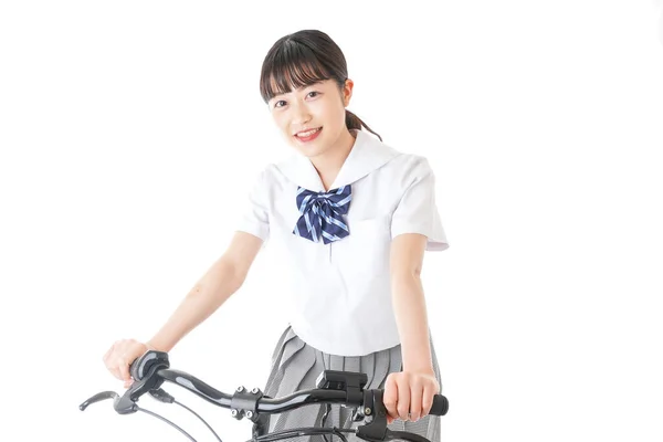 若い学生は自転車で学校に行く — ストック写真