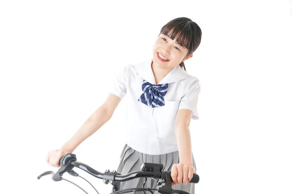 若い学生は自転車で学校に行く — ストック写真