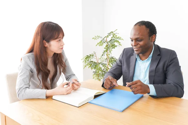 Two business person meeting in the office