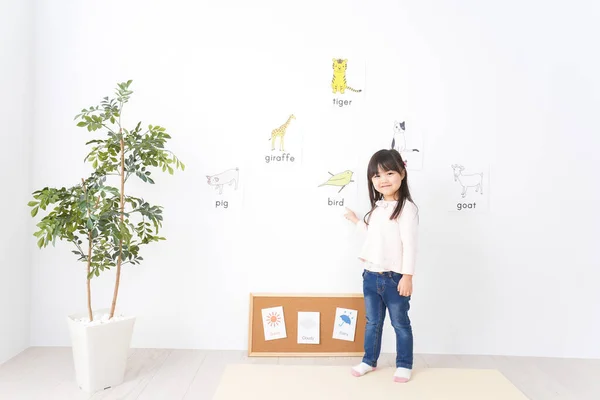 Children study English at classroom