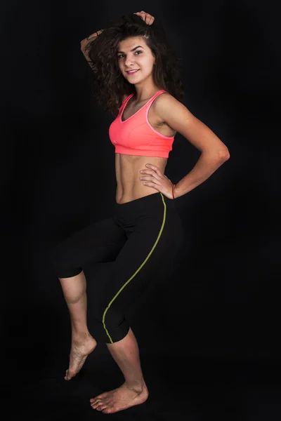 Young attractive female fitness model posing — Stock Photo, Image