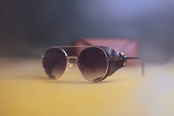 Steampunk sunglasses with leather case on dark background — Stock Photo, Image