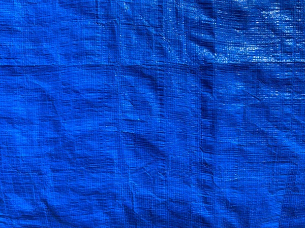 Tarpaulin Pomačkaná Modrá Plachta Pozadí Silného Pružného Vodotěsného Materiálu Plátno — Stock fotografie