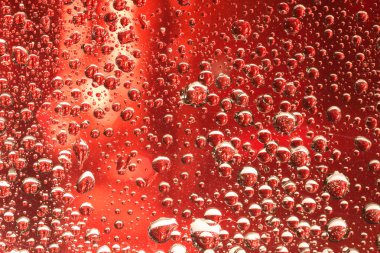 makro çekim yansıması ile sıvı damlacıkları. su ile renk arka plan doku bırakır. Gradyan Rengi