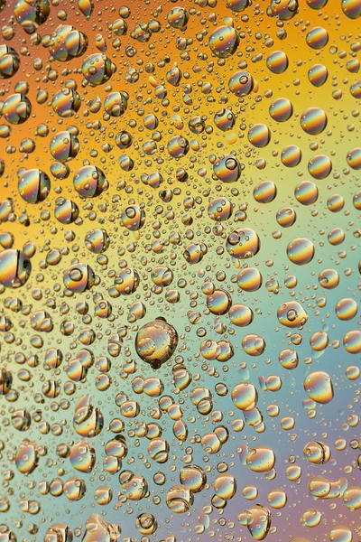 Macro shot of liquid droplets with reflection. color background with water drops texture. gradient color — Stock Photo, Image