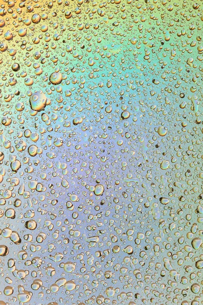 Macro iniezione di goccioline liquide con riflesso. colore di sfondo con texture gocce d'acqua. colore del gradiente — Foto Stock