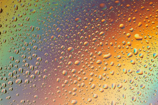 Macro iniezione di goccioline liquide con riflesso. colore di sfondo con texture gocce d'acqua. colore del gradiente — Foto Stock