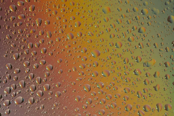 Flytande droplet med färgbilder. ljusa färgade abstrakt bakgrund — Stockfoto