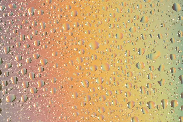 Macro iniezione di goccioline liquide con riflesso. colore di sfondo con texture gocce d'acqua. colore del gradiente — Foto Stock