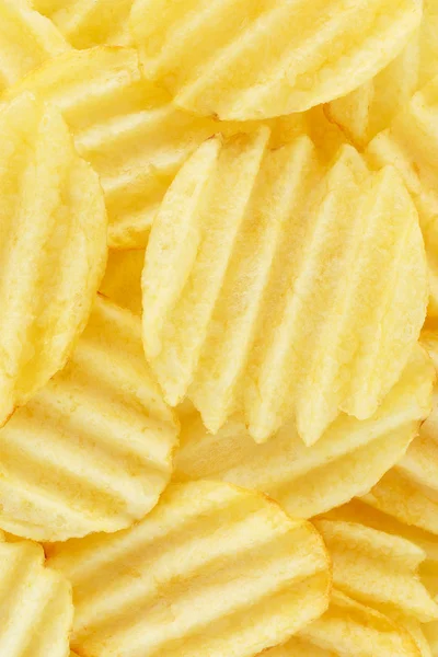 Potatischips. bakgrund mat gul. makro — Stockfoto