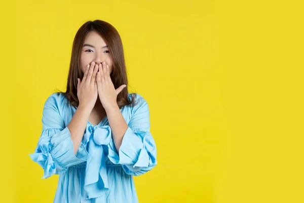 Shocked Woman Covering Mouth Hands Yellow Background — Photo