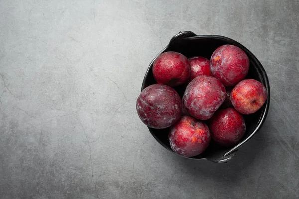 Red Plum Put Black Bowl Dark Floor — Photo