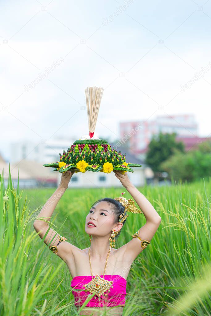 Asia woman in Thai dress traditional hold kratong. Loy krathong festival