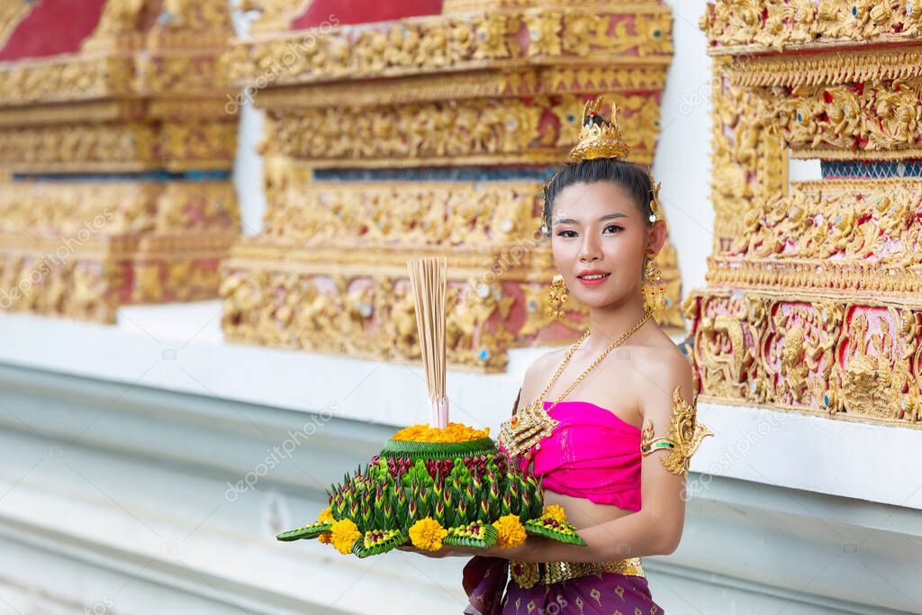 Asia woman in Thai dress traditional hold kratong. Loy krathong festival