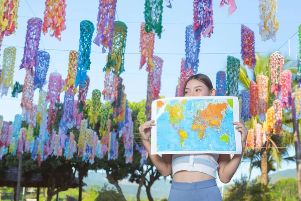 Girl Happily Holding Tourist Map Flower Garden — Stock fotografie