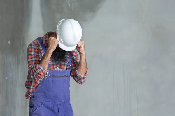 Workers or engineers sad in construction Site