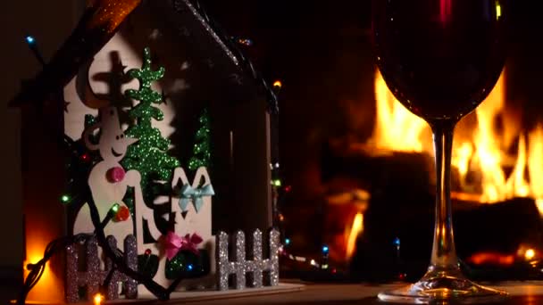 Holiday Season Christmas Decorations Glass Drink Background Fireplace Flame Panning — Stock Video