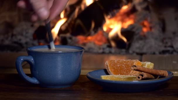 Tea Drinks Man Stirs Teaspoon Milk Cup Drink Background Fireplace — Stock Video