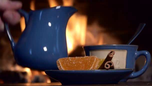 Tea Drinks Man Pours Milk Jug Tea Background Fireplace Flame — Stock Video