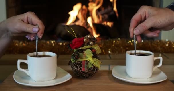 Romantic Evening Man Woman Stir Coffee Cups Teaspoons Background Fireplace — Stock Video
