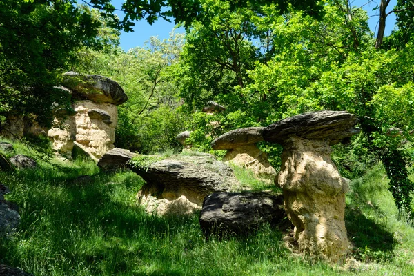 Erratic boulders on earth pillars Stock Photo