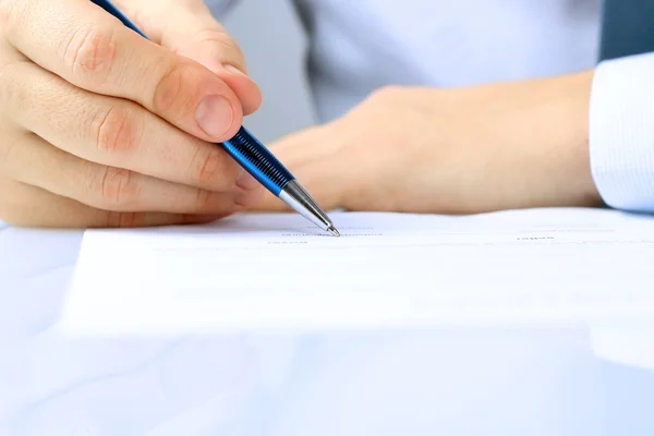 Businessman is signing a contract, business contract details Stock Photo