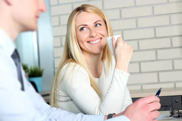 Business colleagues working together and analyzing financial figures while drinking coffee — Stock Photo, Image