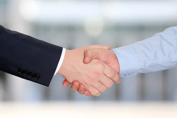 Close-up image of a firm handshake  between two colleagues outside — Stock Photo, Image