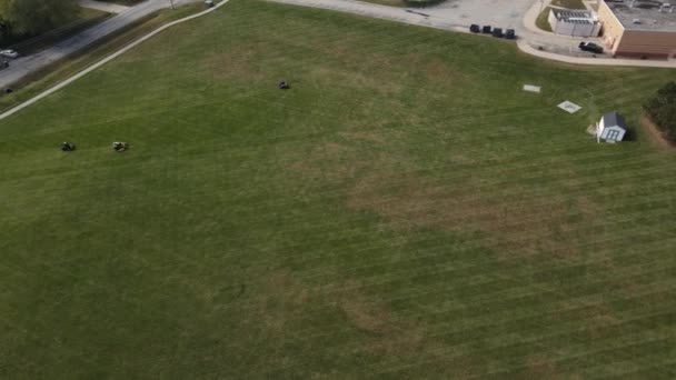 Slowly Flying Various School Community Fields Lawn Mowing Process American — Stock Video