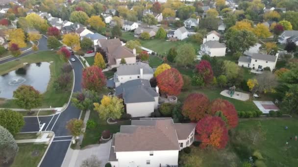 Silver Car Driving Suburban Neighborhood Fall Season Aerial Autumn Colors — Stock Video