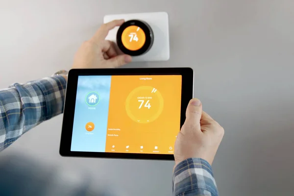 Man Adjusting Temperature Using Tablet Smart Home App Modern Living — Stock Photo, Image