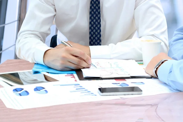 Business colleagues working together and analyzing financial fig — Stock Photo, Image