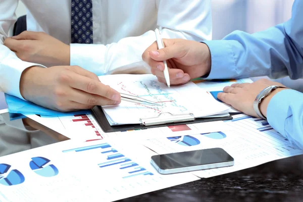 Business colleagues working together and analyzing financial fig — Stock Photo, Image