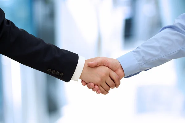 Close-up image of a firm handshake  between two colleagues in of — Stock Photo, Image